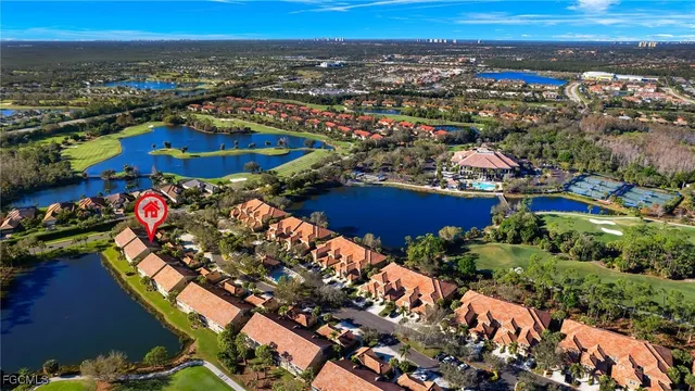 an aerial view of a houses and an outdoor space