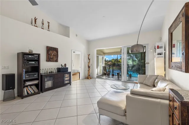 a living room with furniture and large windows