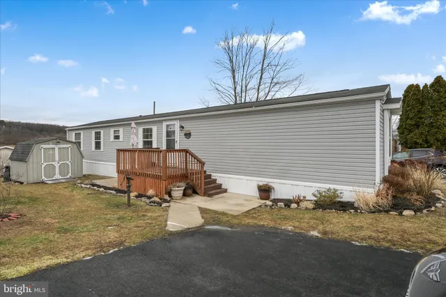 a view of a house with a yard and garage