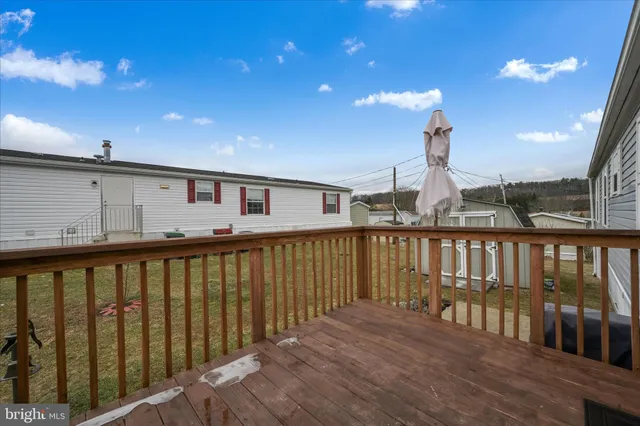 a view of a balcony with wooden floor