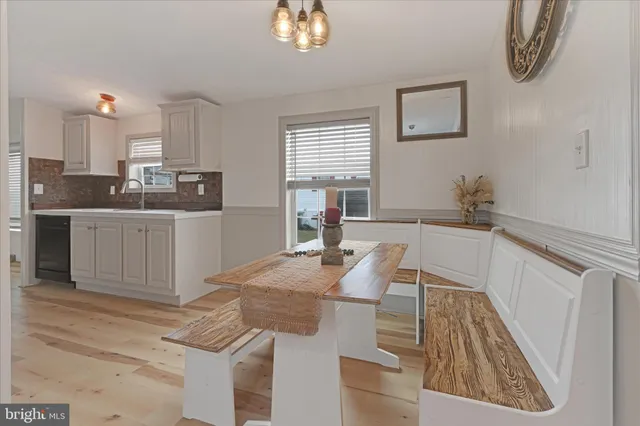 a open kitchen with cabinets a sink and dishwasher