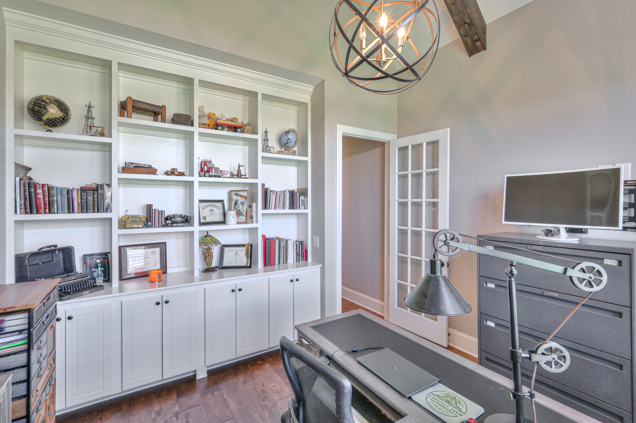 8019 Burning Tree Farms Road Arrington, TN 37014 - Photo 18 of 47 a view of a workspace with furniture and a flat screen tv