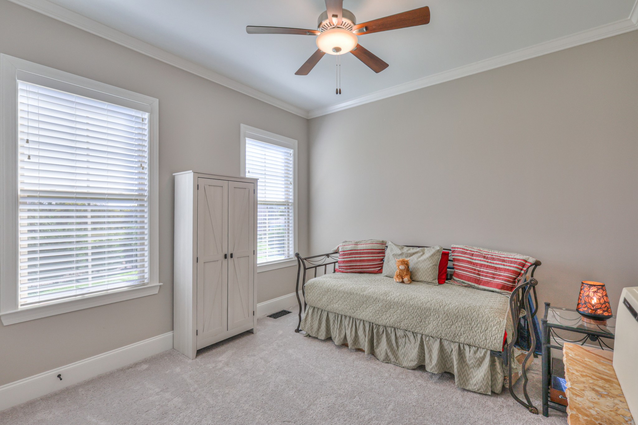 8019 Burning Tree Farms Road Arrington, TN 37014 - Photo 20 of 47 a bedroom with a bed and a chandelier