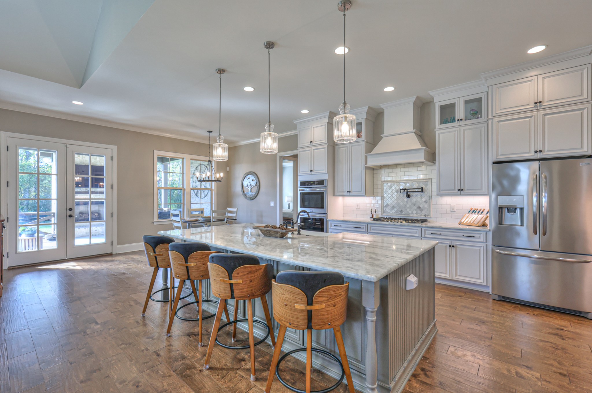 8019 Burning Tree Farms Road Arrington, TN 37014 - Photo 2 of 47 a kitchen with stainless steel appliances granite countertop kitchen island wooden cabinets and refrigerator