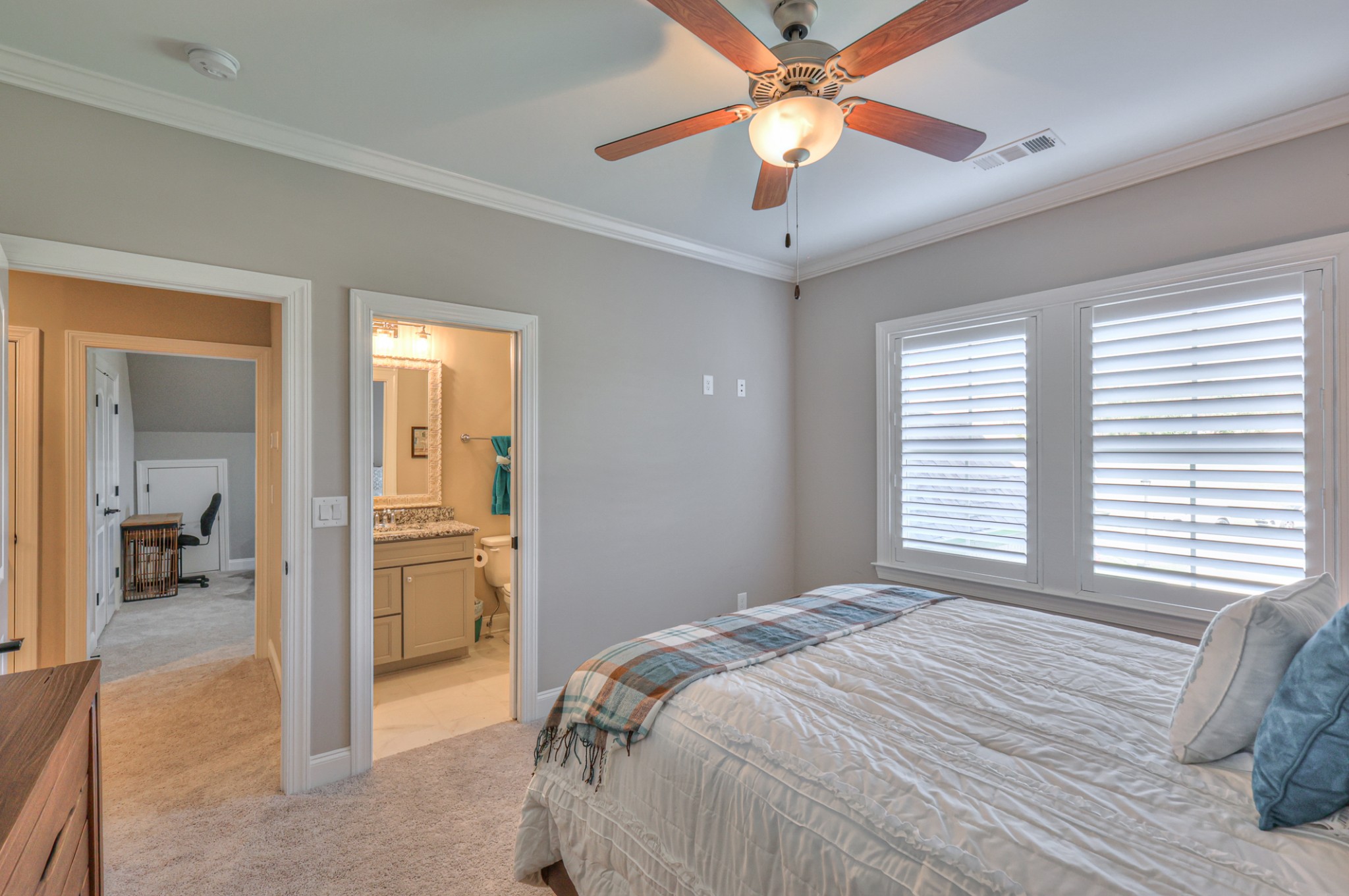 8019 Burning Tree Farms Road Arrington, TN 37014 - Photo 29 of 47 a bedroom with a bed and a chandelier