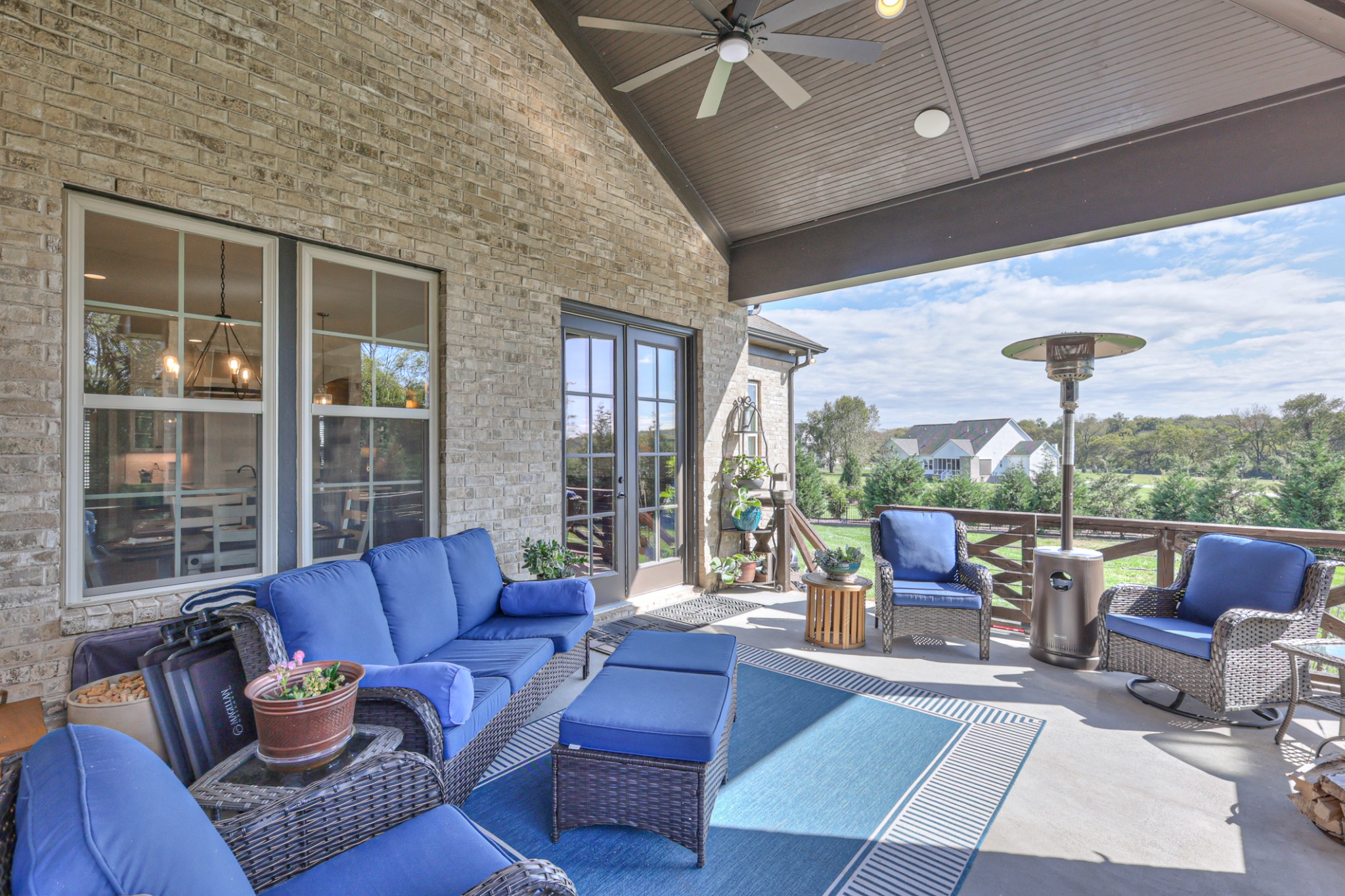 8019 Burning Tree Farms Road Arrington, TN 37014 - Photo 32 of 47 a outdoor living space with furniture and a floor to ceiling window