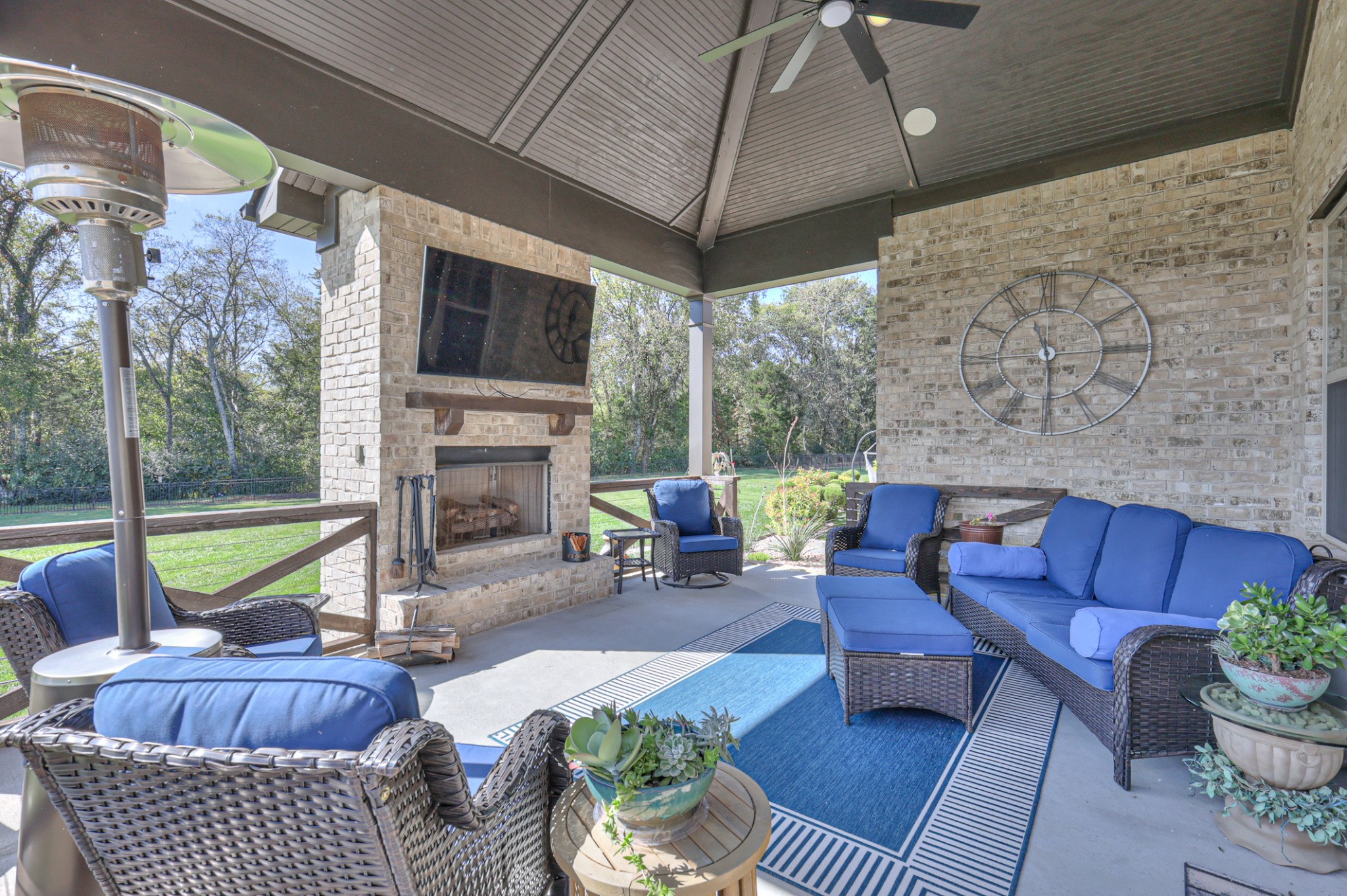 8019 Burning Tree Farms Road Arrington, TN 37014 - Photo 33 of 47 a living room with furniture a flat screen tv and a fireplace