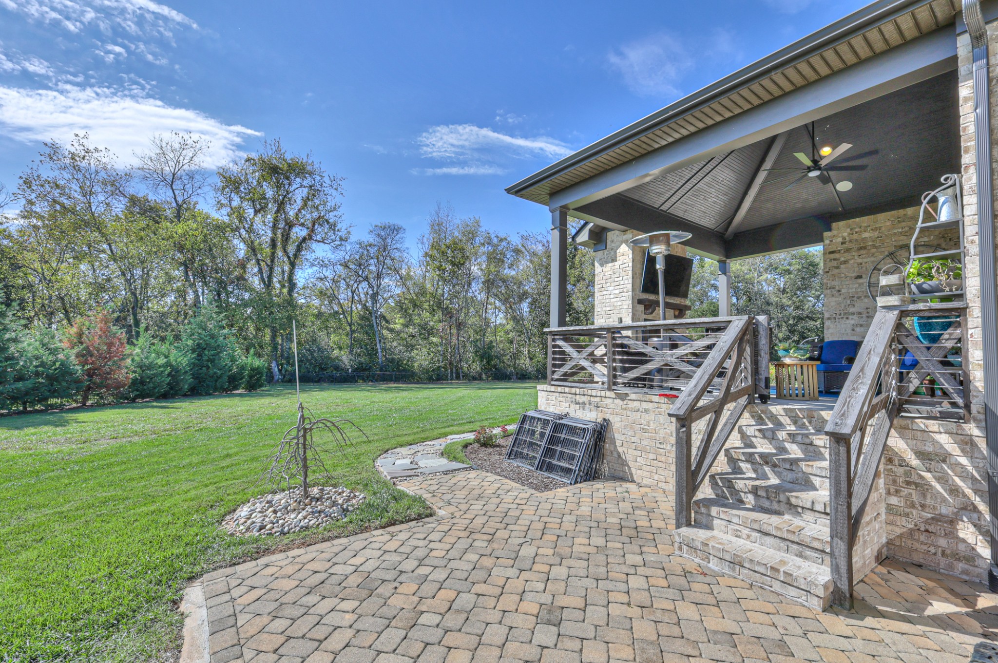 8019 Burning Tree Farms Road Arrington, TN 37014 - Photo 34 of 47 a view of a patio with table and chairs with wooden floor and fence