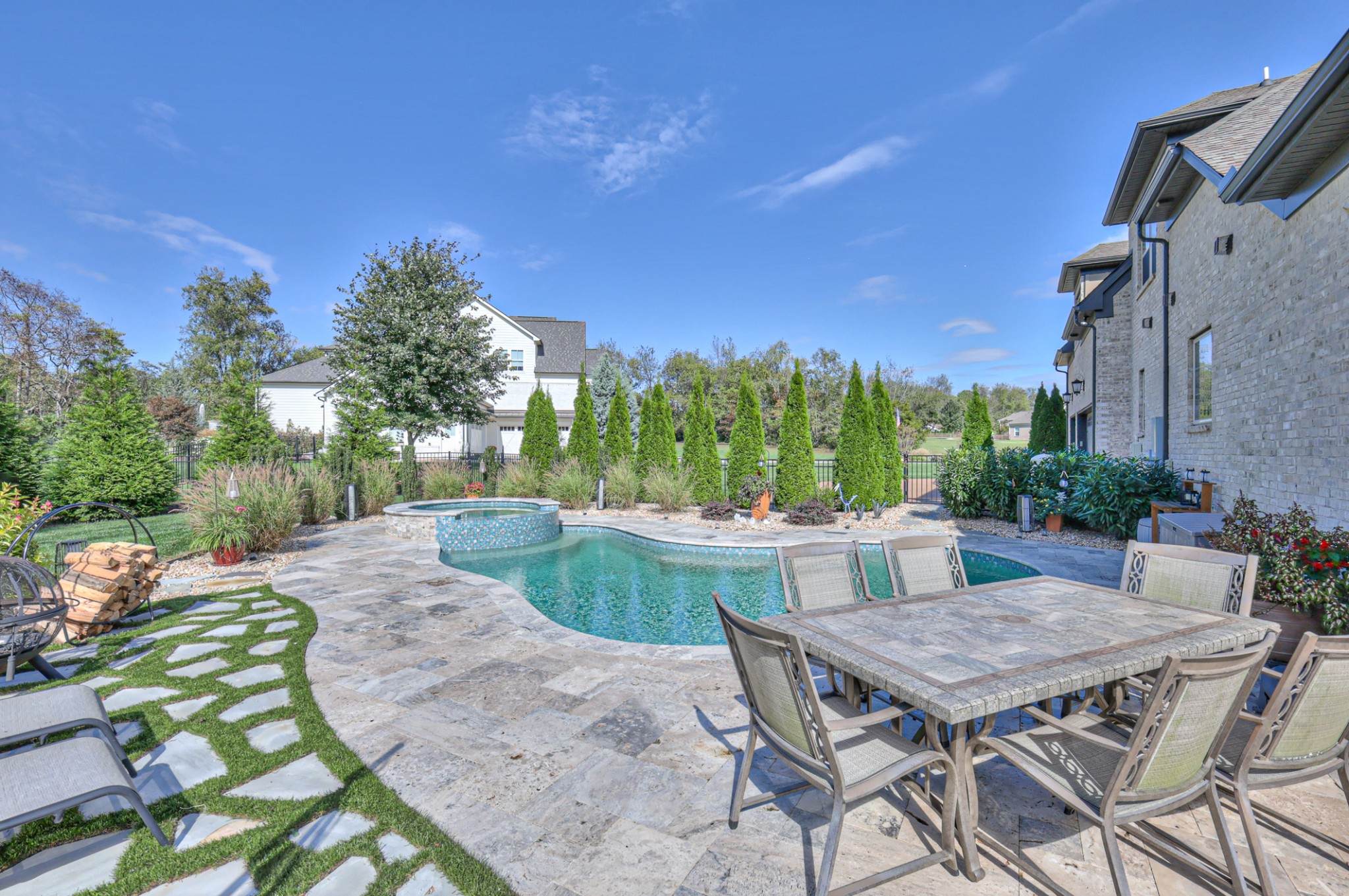 8019 Burning Tree Farms Road Arrington, TN 37014 - Photo 35 of 47 a view of a patio with table and chairs a barbeque and potted plants