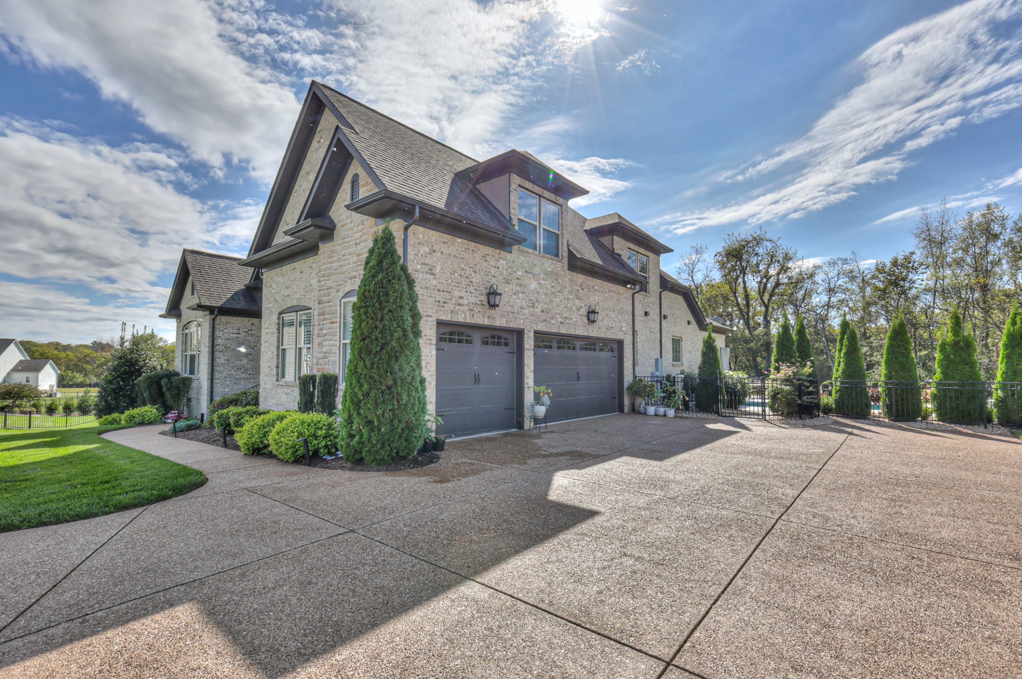 8019 Burning Tree Farms Road Arrington, TN 37014 - Photo 44 of 47 a front view of a house with a yard and garage