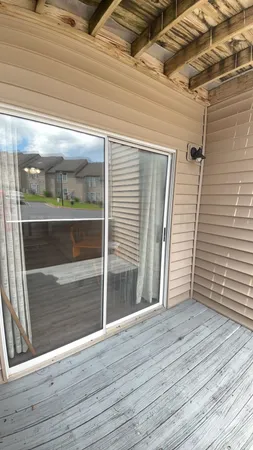 a view of backyard and wooden floor