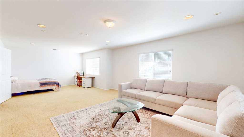 1279 Longbranch Road San Jacinto, CA 92582 - Photo 23 of 35 a living room with furniture and a couch