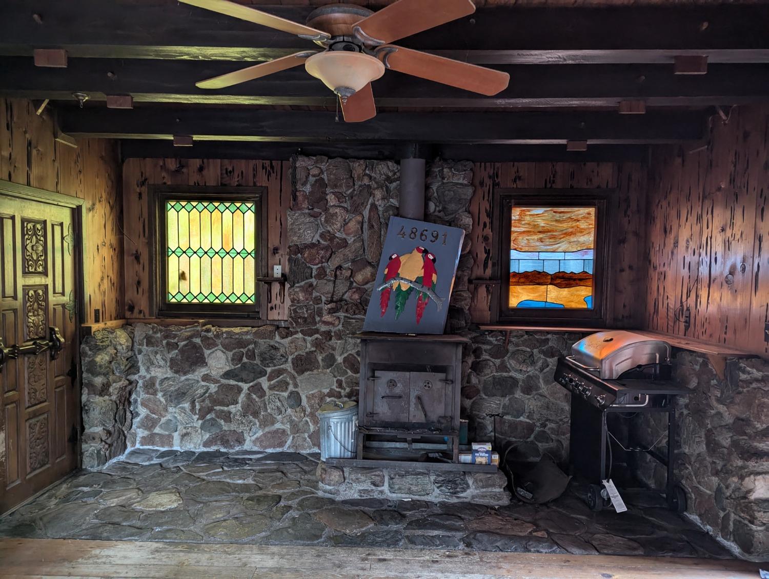 48691 Todd Eymann Road Miramonte, CA 93641 - Photo 17 of 17 a living room with fireplace furniture and a flat screen tv