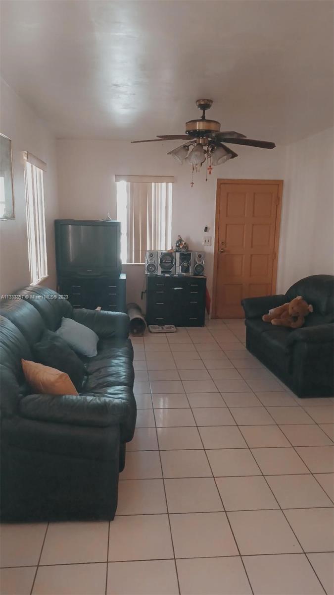 Flagami Miami, FL 33144 - Photo 3 of 6 a living room with furniture and a ceiling fan