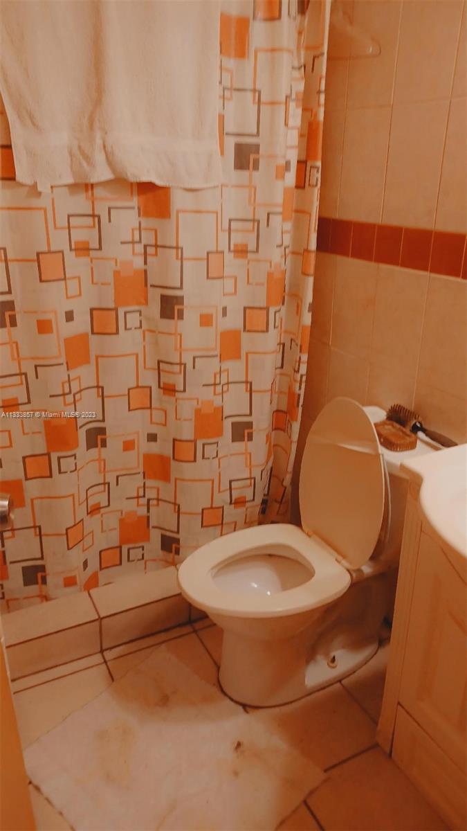 Flagami Miami, FL 33144 - Photo 6 of 6 a bathroom with a toilet and a shower