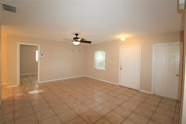 a view of an empty room and window