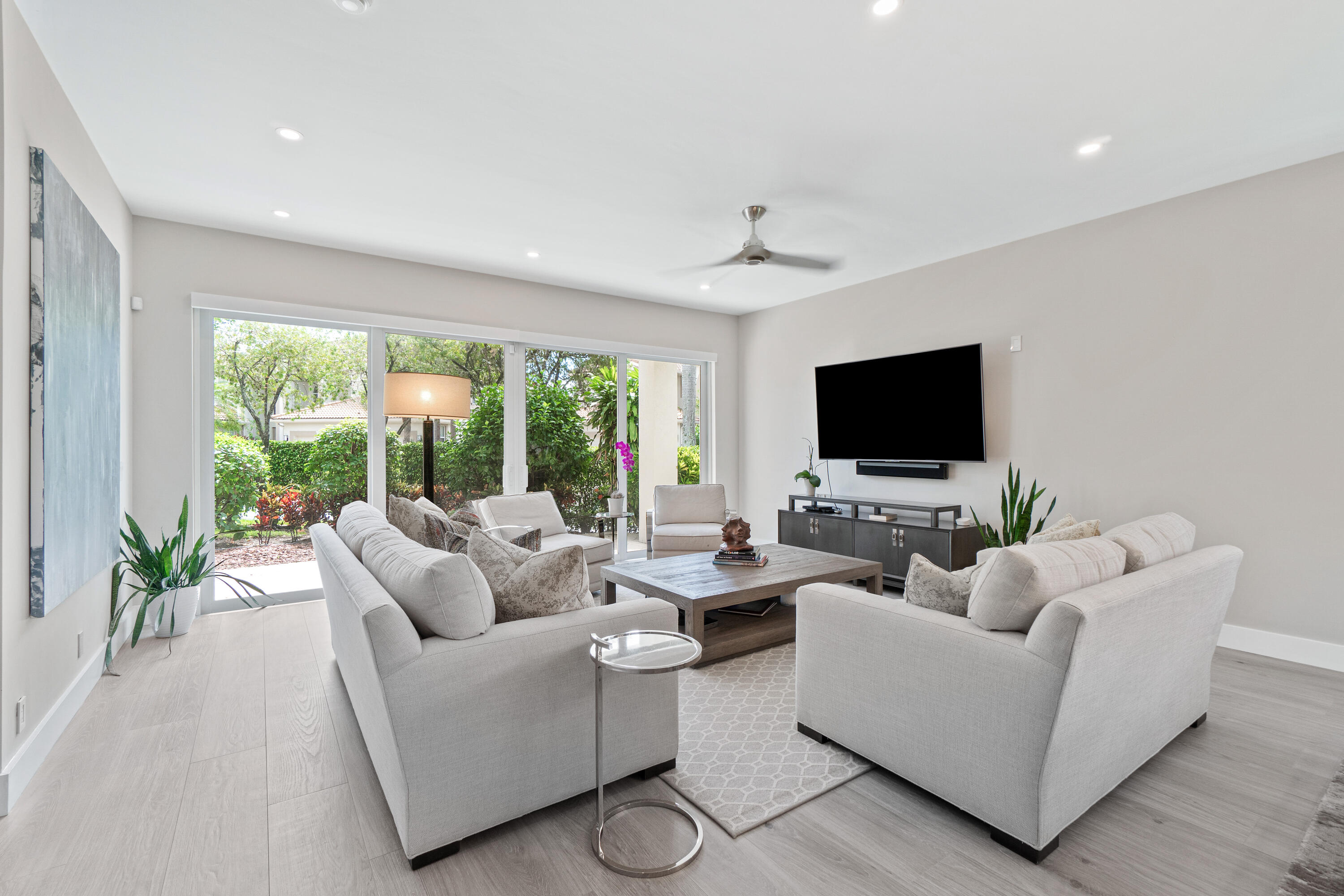 6308 Graycliff Drive, Unit B Boca Raton, FL 33496 - Photo 11 of 29 a living room with furniture and a flat screen tv