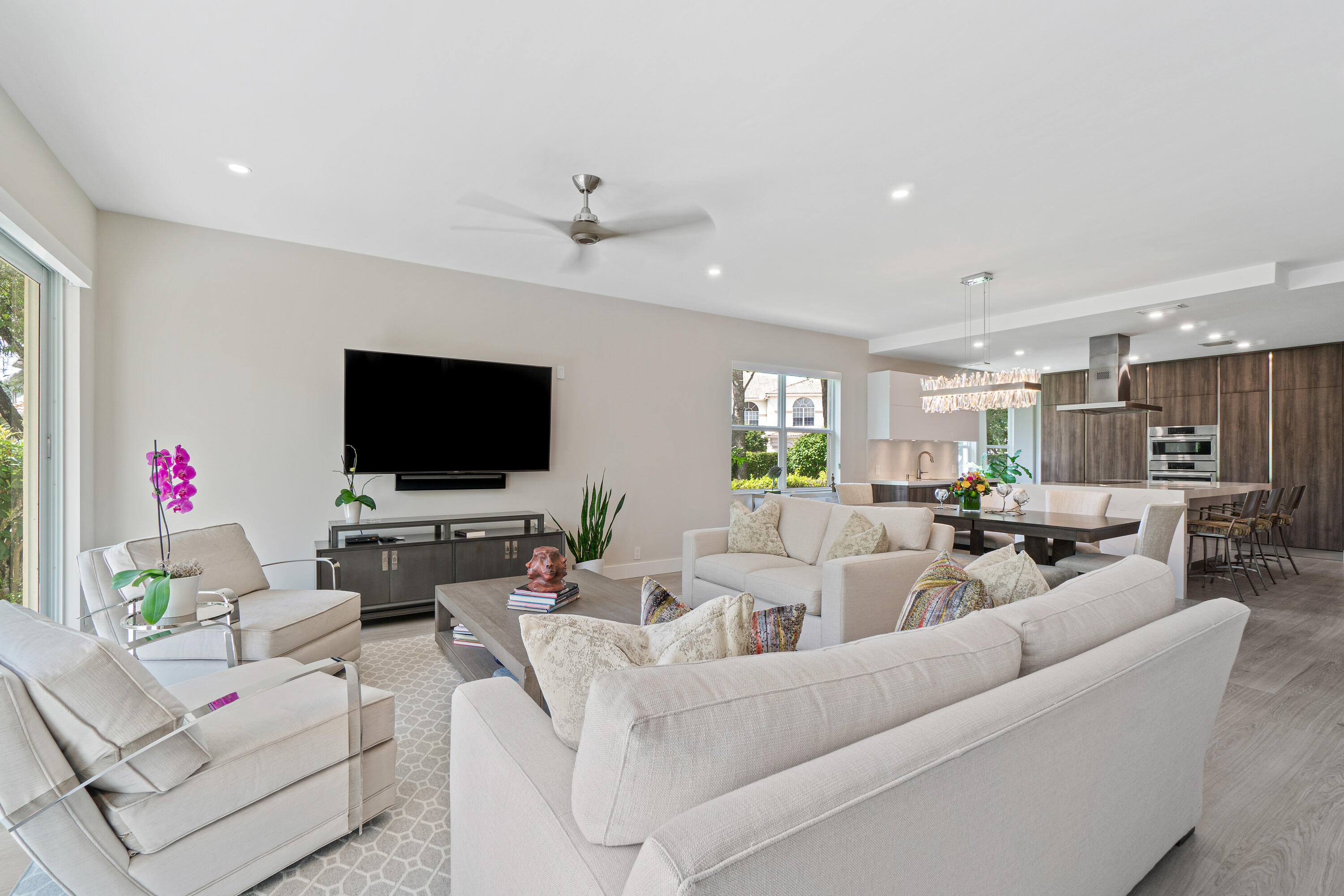 6308 Graycliff Drive, Unit B Boca Raton, FL 33496 - Photo 13 of 29 a living room with furniture and a flat screen tv