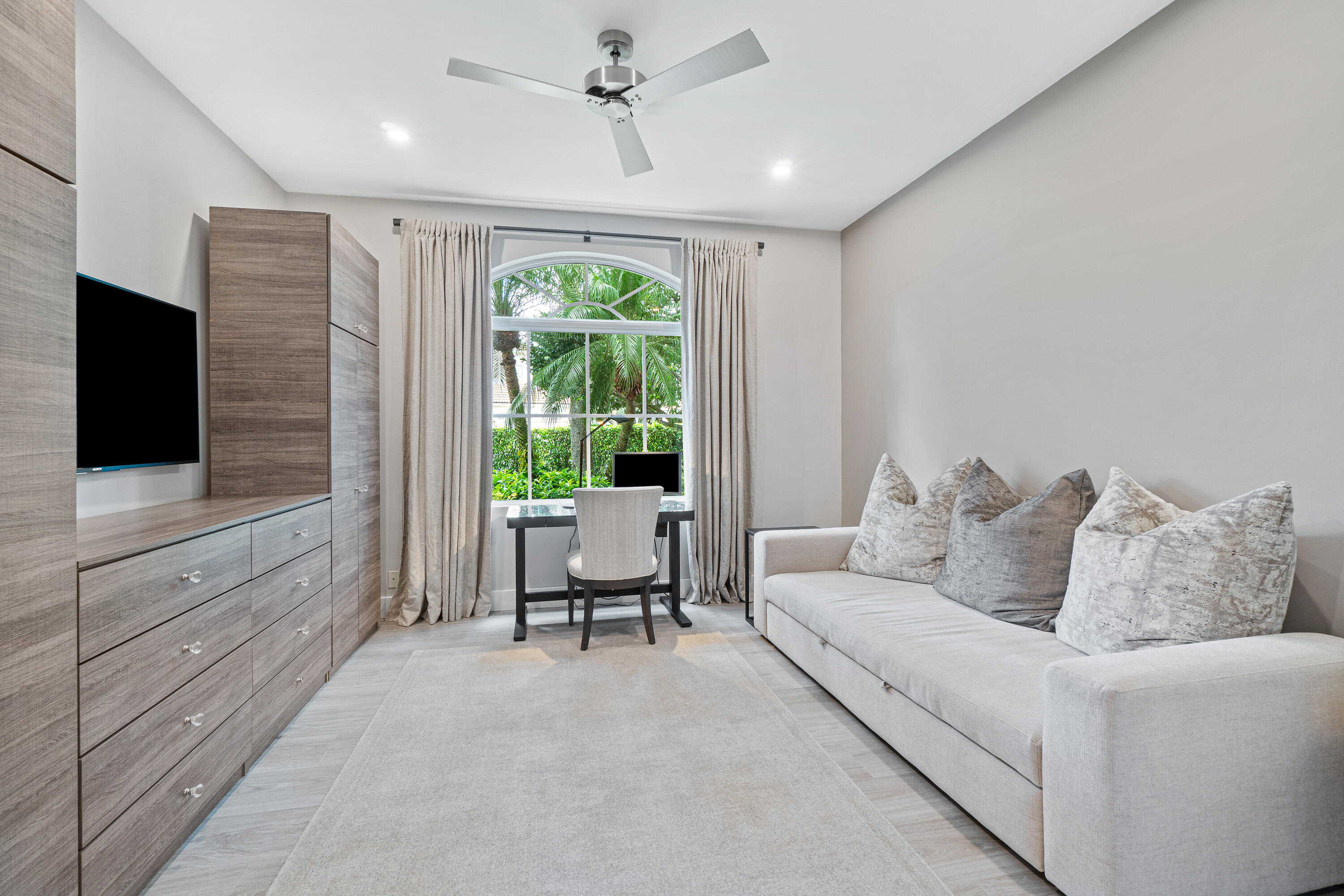 6308 Graycliff Drive, Unit B Boca Raton, FL 33496 - Photo 16 of 29 a living room with furniture and a flat screen tv