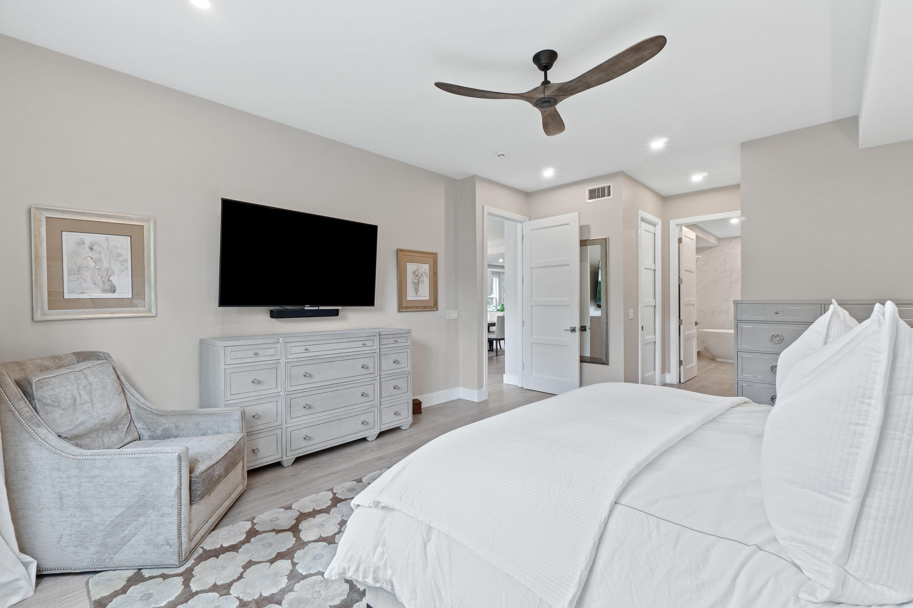 6308 Graycliff Drive, Unit B Boca Raton, FL 33496 - Photo 19 of 29 a bedroom with furniture and a flat screen tv