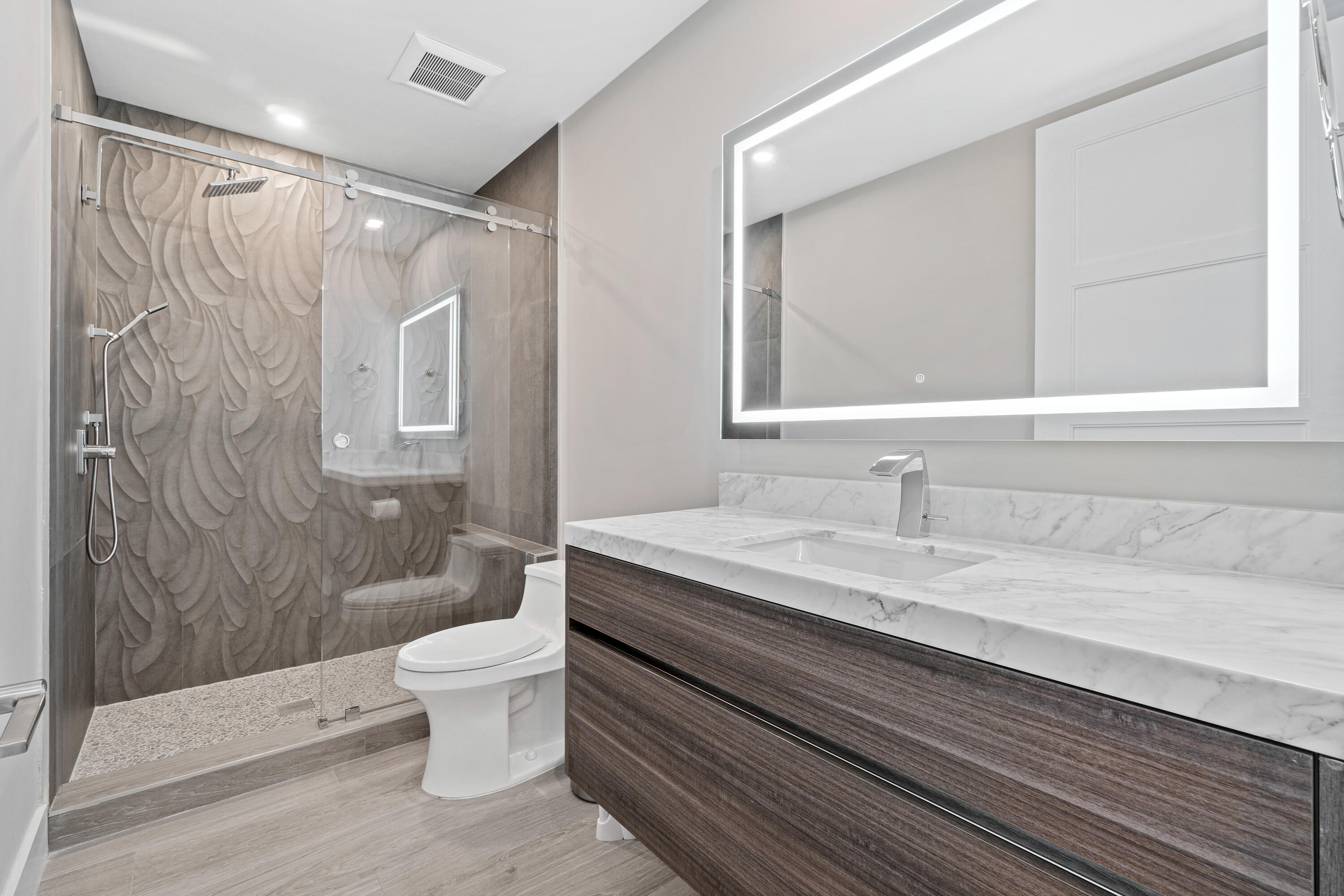 6308 Graycliff Drive, Unit B Boca Raton, FL 33496 - Photo 24 of 29 a bathroom with a granite countertop sink a toilet and a shower