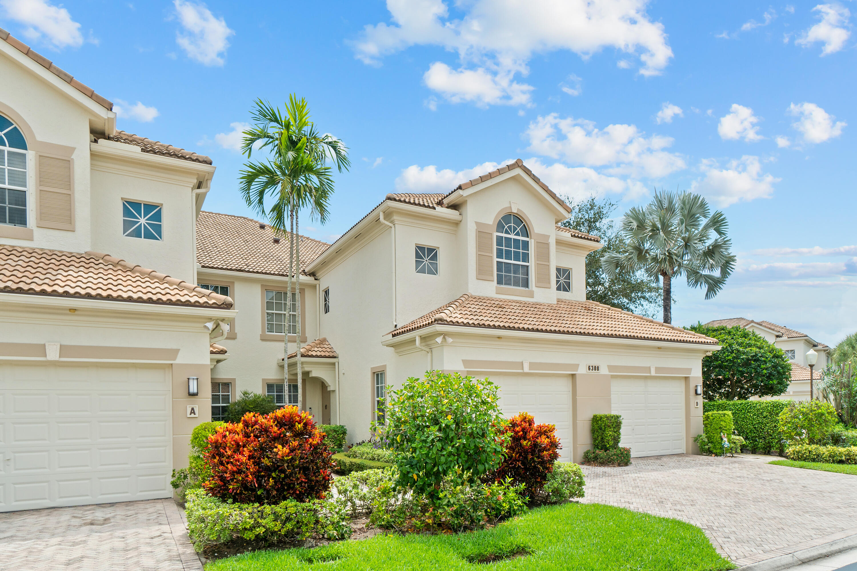6308 Graycliff Drive, Unit B Boca Raton, FL 33496 - Photo 26 of 29 a front view of a house with a garden