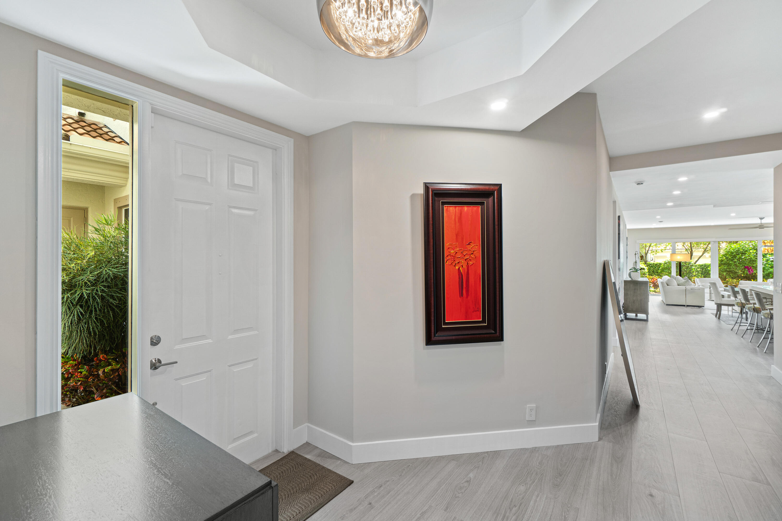 6308 Graycliff Drive, Unit B Boca Raton, FL 33496 - Photo 4 of 29 wooden floor in an empty room with a window