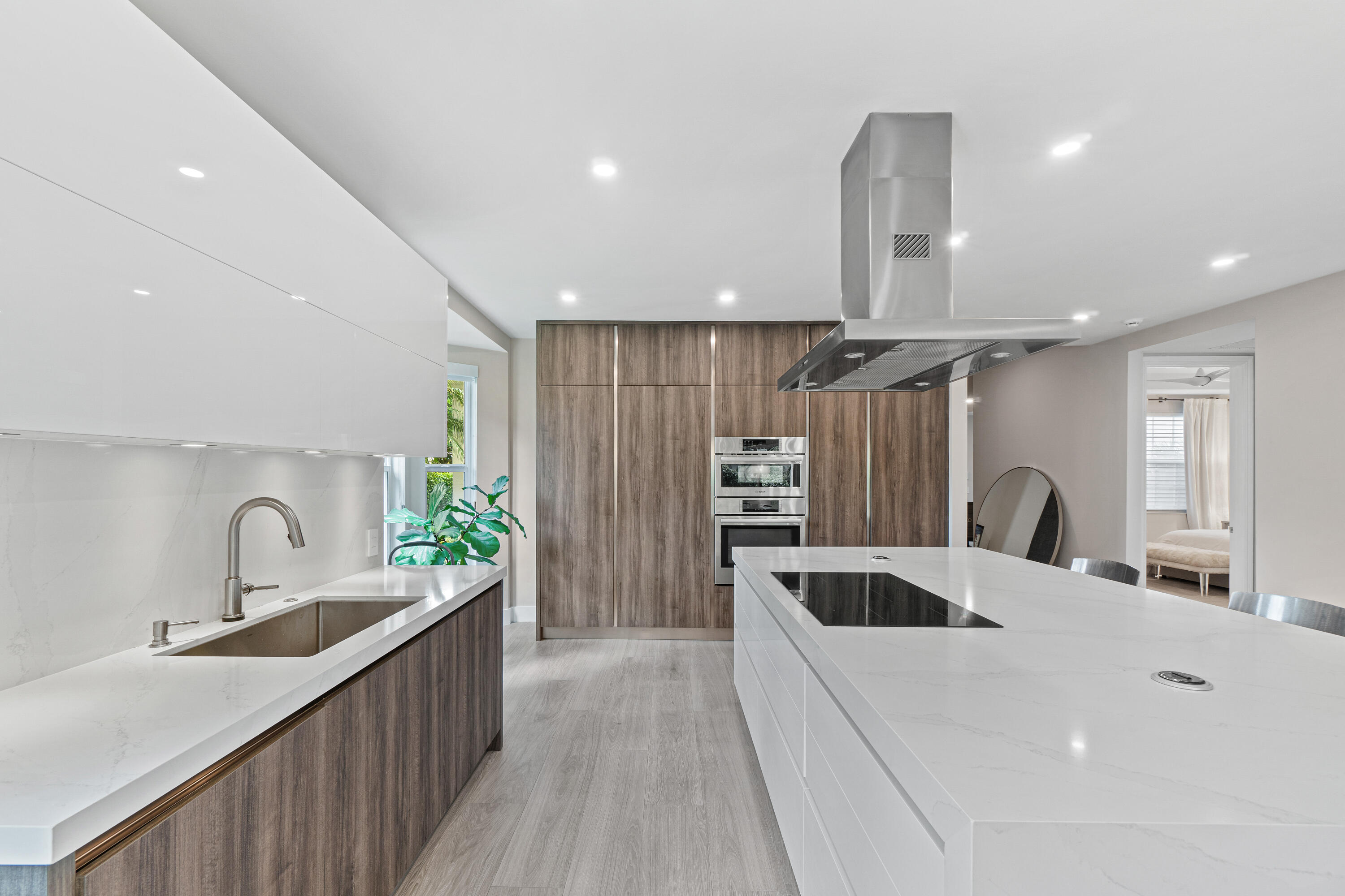 6308 Graycliff Drive, Unit B Boca Raton, FL 33496 - Photo 6 of 29 a kitchen with kitchen island a sink appliances and cabinets