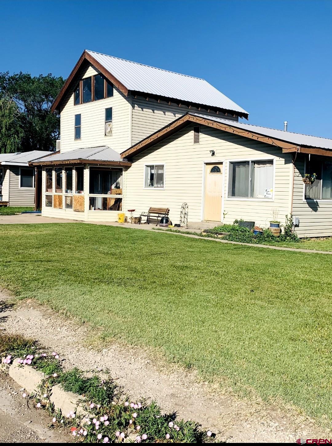 1128 Montana Way Nucla, CO 81424 - Photo 1 of 30 a front view of a house with a yard