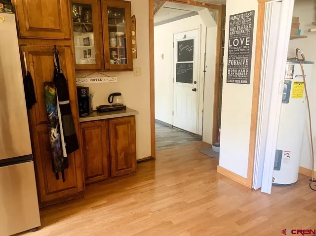 a kitchen with a sink a window and cabinets