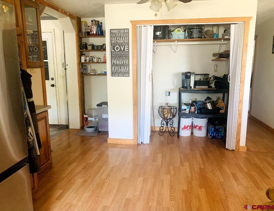 1128 Montana Way Nucla, CO 81424 - Photo 17 of 30 a view of a living room with furniture and a wooden floor