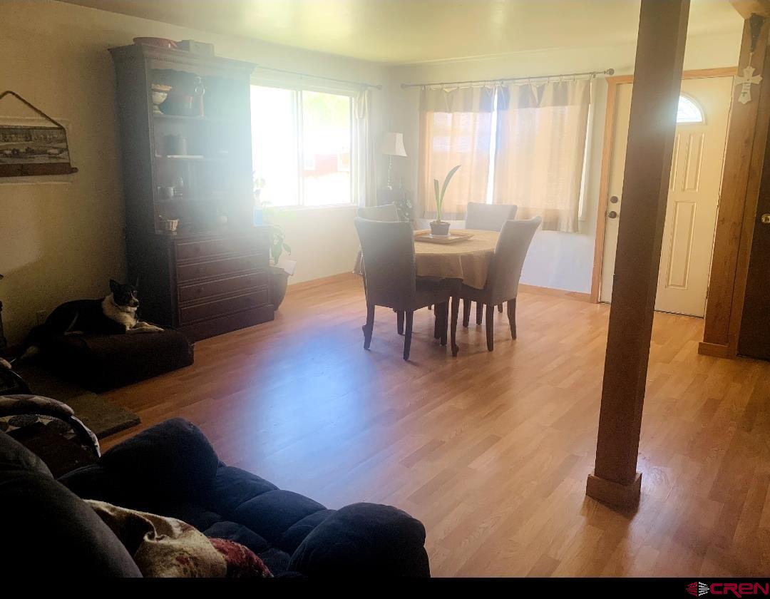 1128 Montana Way Nucla, CO 81424 - Photo 23 of 30 a view of a room with furniture and wooden floor