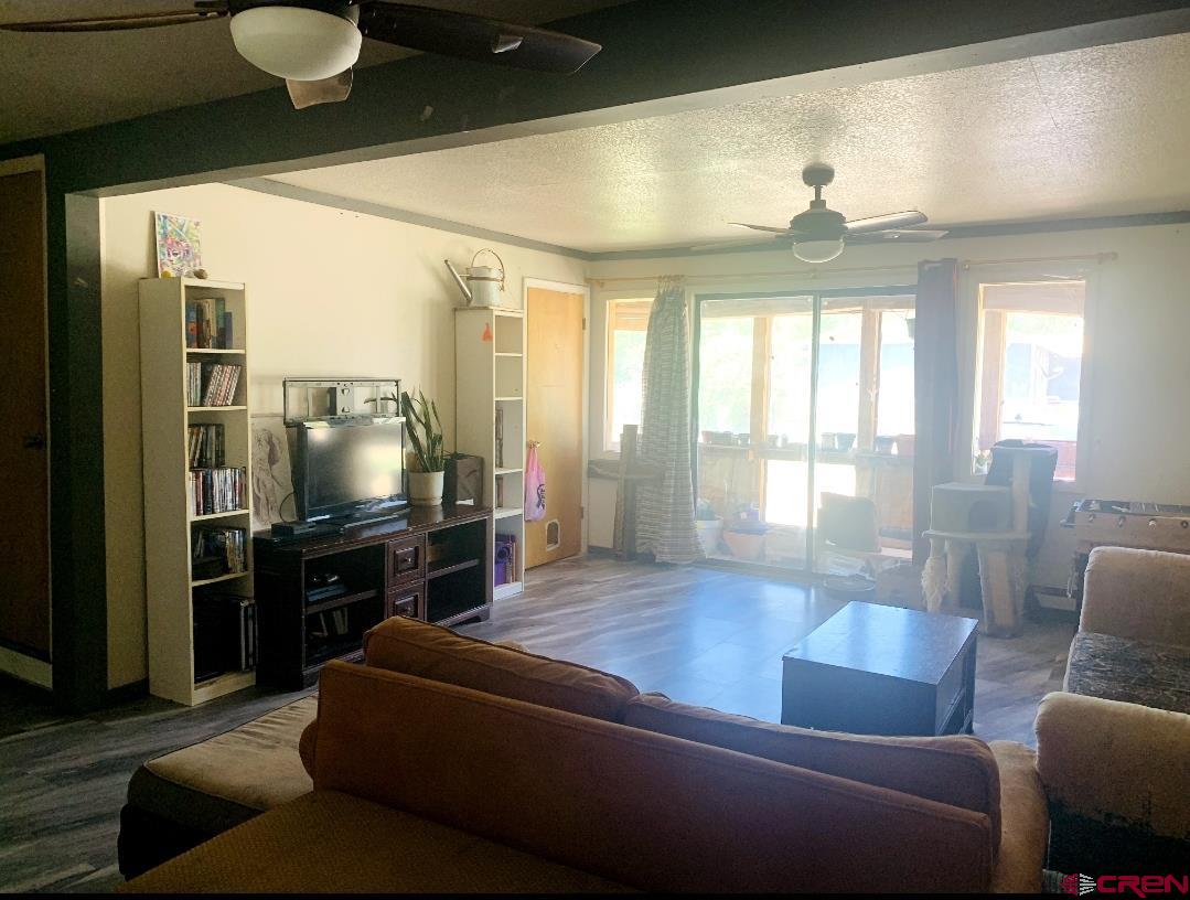 1128 Montana Way Nucla, CO 81424 - Photo 25 of 30 a living room with furniture and a large window