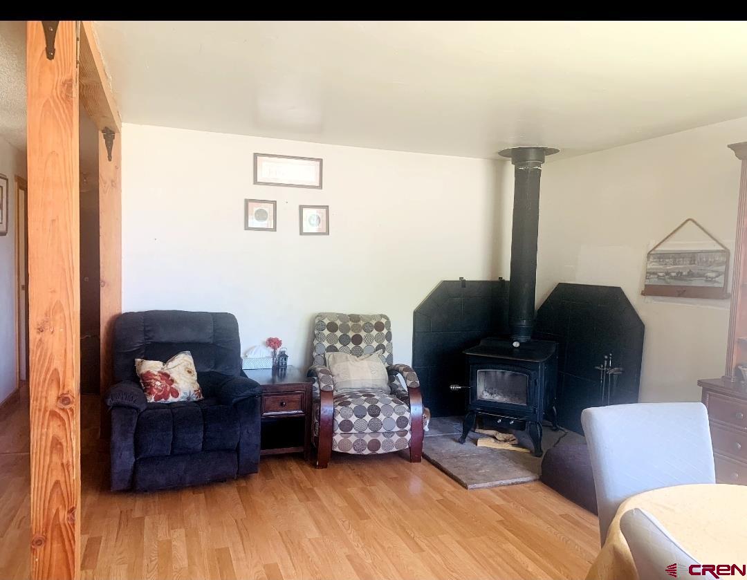 1128 Montana Way Nucla, CO 81424 - Photo 26 of 30 a living room with furniture and wooden floor