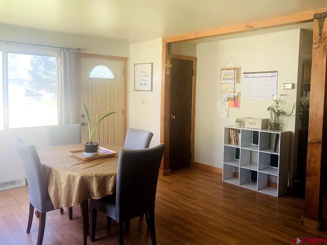 1128 Montana Way Nucla, CO 81424 - Photo 27 of 30 a view of a dining room with furniture and wooden floor