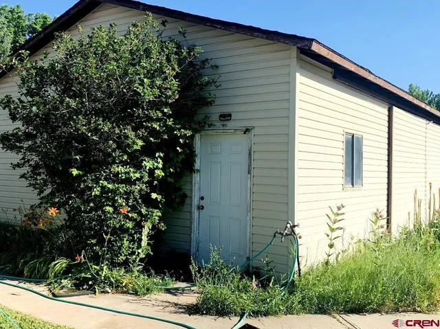 a view of a house with a tree