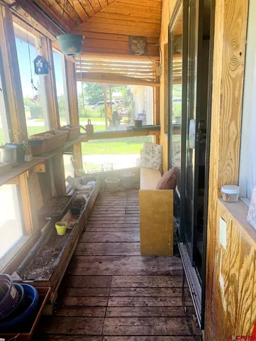 a swimming pool with outdoor seating and yard