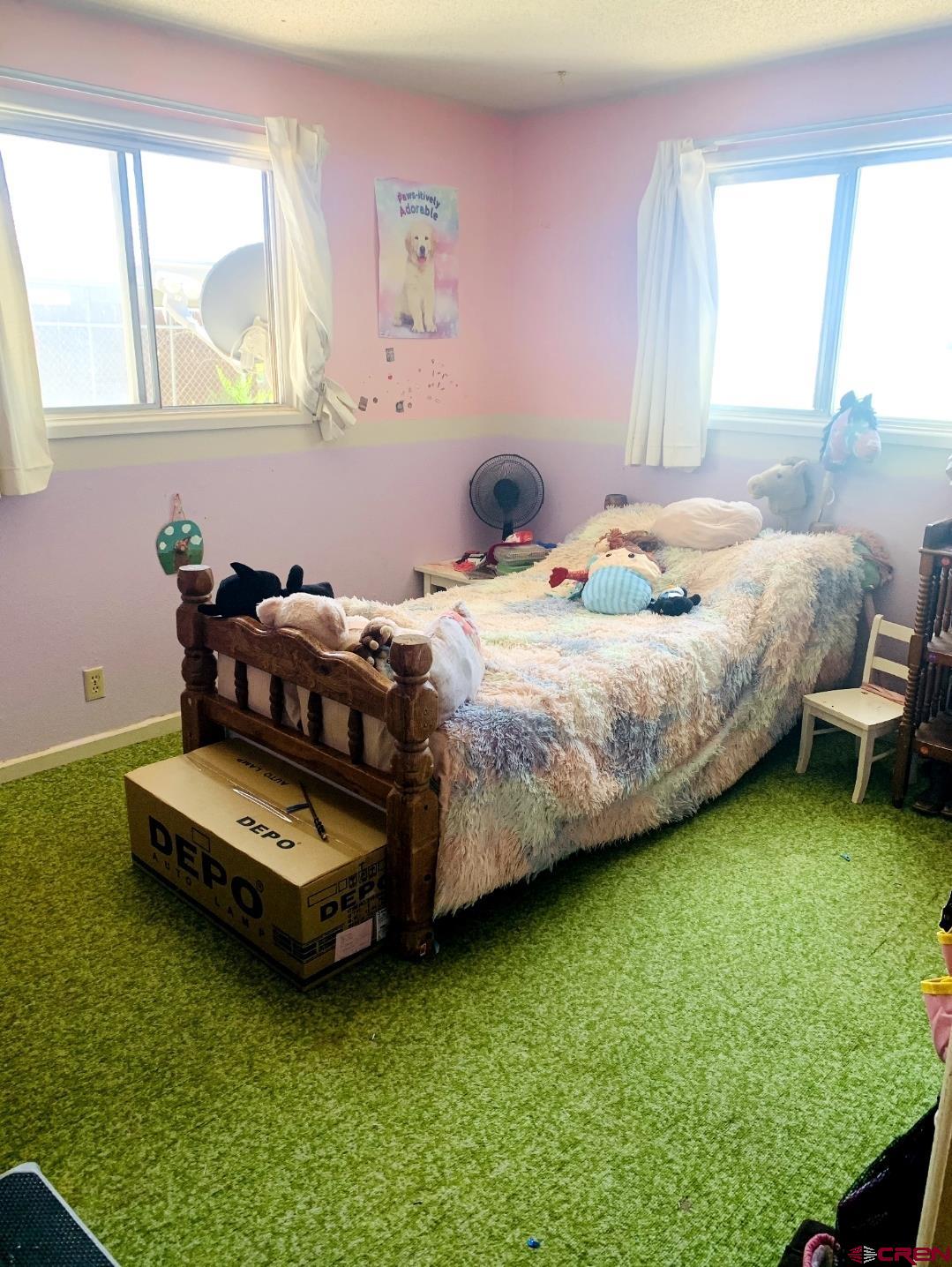 1128 Montana Way Nucla, CO 81424 - Photo 10 of 30 a bedroom with bed and windows