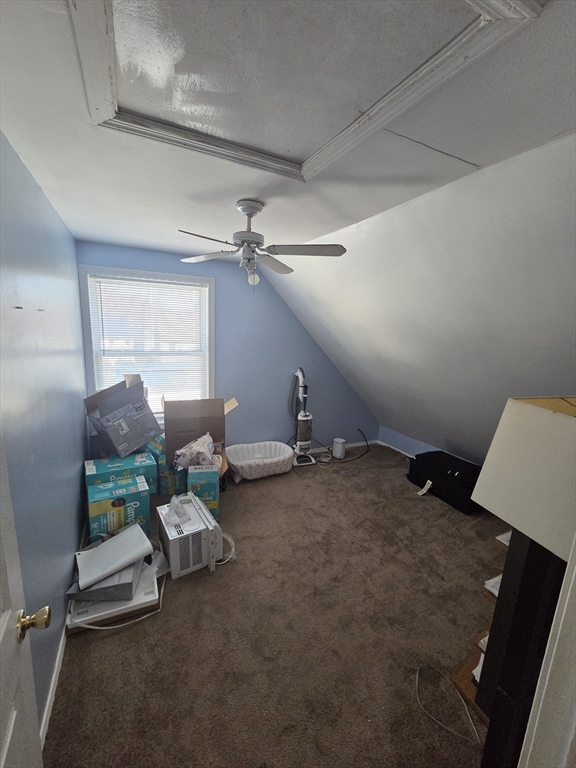 32 Crowell Street Boston, MA 02124 - Photo 18 of 18 a living room with furniture and a chandelier