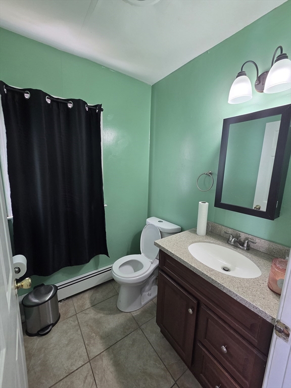 32 Crowell Street Boston, MA 02124 - Photo 9 of 18 a bathroom with a sink a toilet and mirror