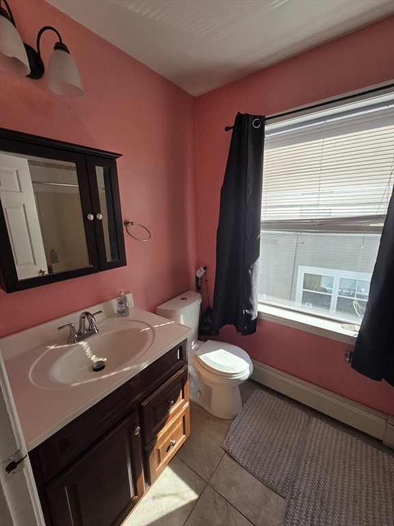 32 Crowell Street Boston, MA 02124 - Photo 10 of 18 a bathroom with a sink vanity mirror and toilet