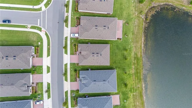 an aerial view of a house with a garden and plants