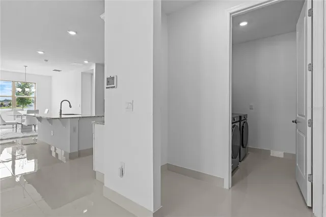 a view of a kitchen from the hallway