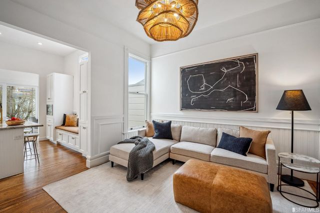 a living room with furniture and a rug