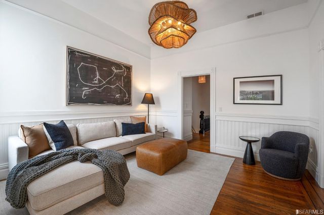 a kitchen with stainless steel appliances a stove a sink and a refrigerator