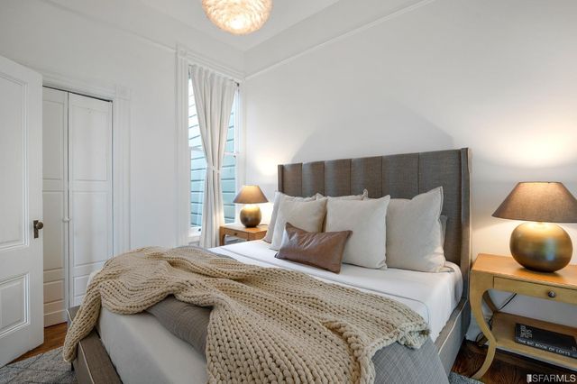 a view of a balcony with wooden floor and outdoor seating