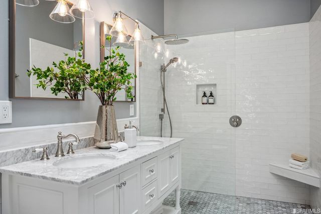 a view of a backyard with furniture and a garden
