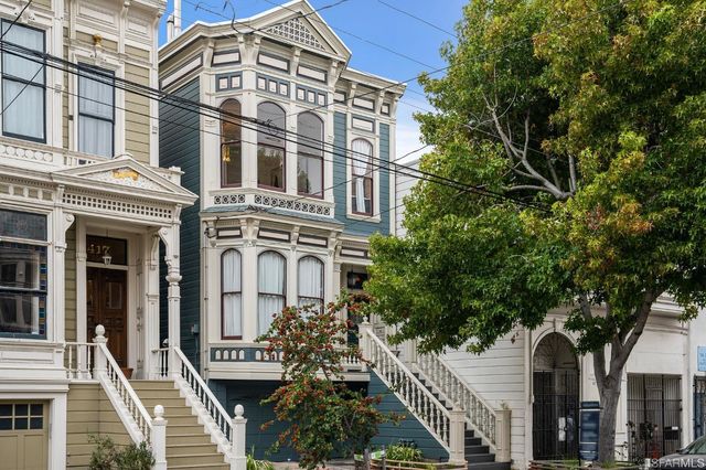 a bedroom with a bed and a lamp