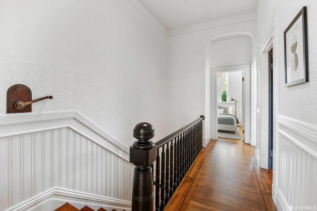 a view of a hallway with a bathtub