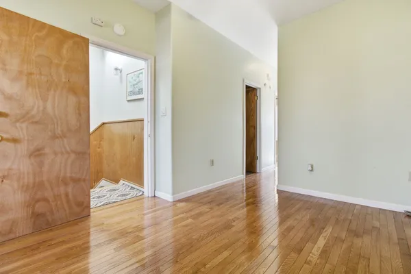 a view of a bathroom with wooden floor
